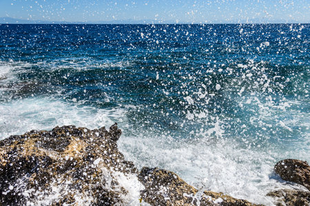 waves on the sea landscape on a background of blue sky with clouds