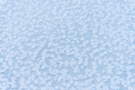 ice on the frozen pond with snowflakes abstract shapes の写真素材