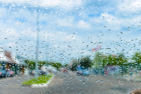 rain drops on glass with a backgroundの写真素材