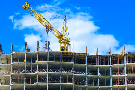 Building of the new high house by the craneの写真素材