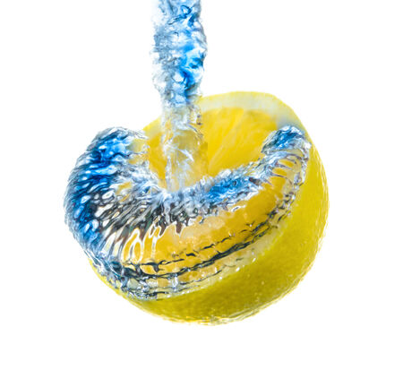 slice of fresh ripe juicy lemon water bubblesの写真素材