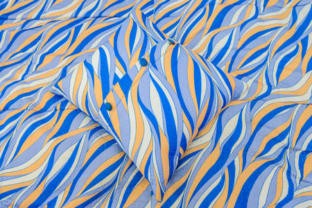 a small cushion for a sofa abstract object