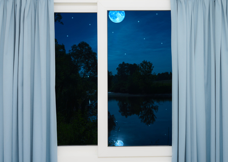 view from the window night landscape large moonの写真素材