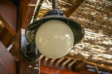 small lantern in a garden on the groundの写真素材