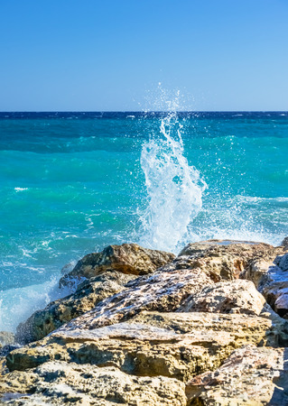 waves on the sea landscape on a background of blue sky with cloudsの写真素材