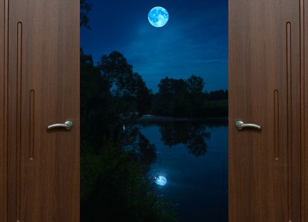 open door view night landscape with the big moonの写真素材