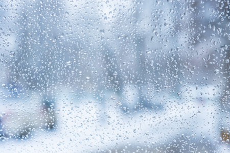 rain drops on glass with a backgroundの写真素材