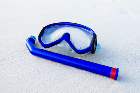 blue mask and snorkel diving on the white sandの写真素材