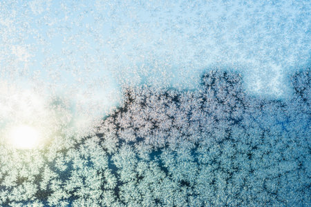 frozen Snowflake on glass is not against the blue sky