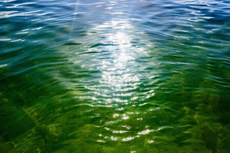 reflection of the sun on the water surfaceの写真素材