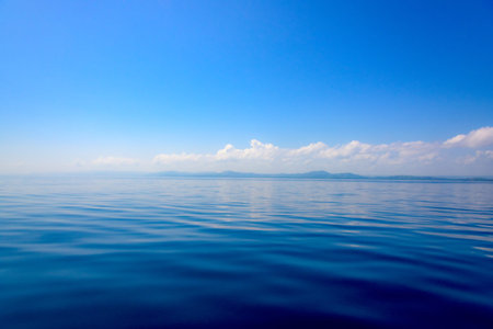waves on the sea landscape on a background of blue sky with clouds