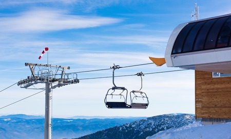 chair lift for skiing in the mountains in winterの写真素材