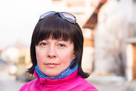 portrait of a middle-aged brunette woman on a background of natureの写真素材