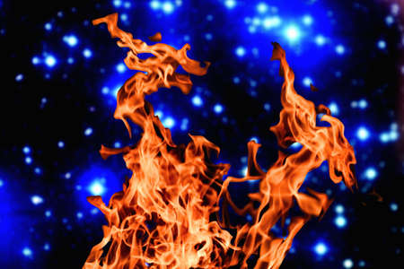 furious raging flames red fire black backgroundの写真素材