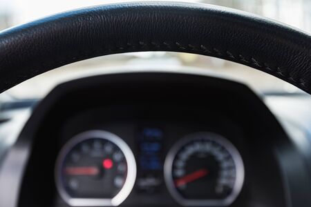 leather steering wheel of a modern car with control buttonsの写真素材