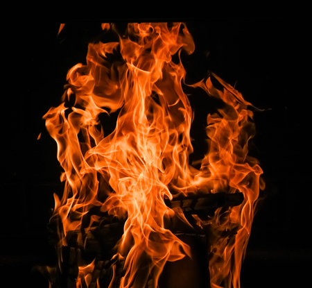 furious raging flames red fire black background