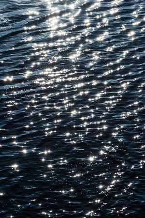 reflection of the sun on the water surfaceの写真素材