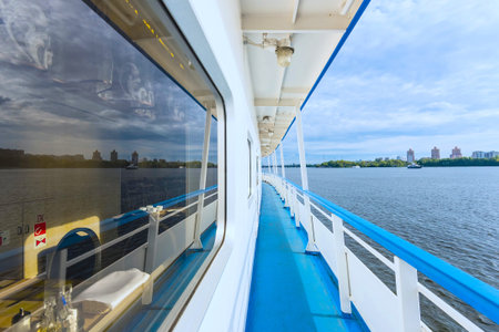 view of the side of a river cruise ship floats on the channel