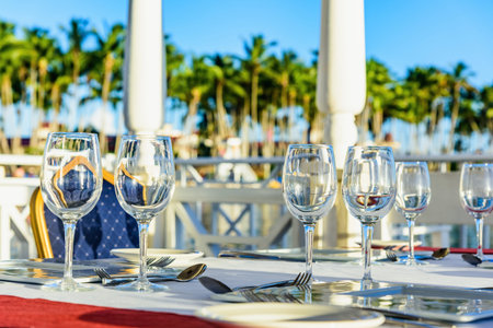 served a festive table in the gazebo near the sea at sunset