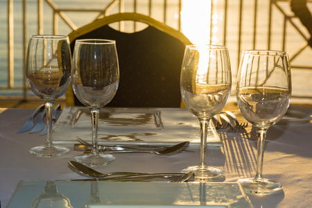 served a festive table in the gazebo near the sea at sunsetの写真素材