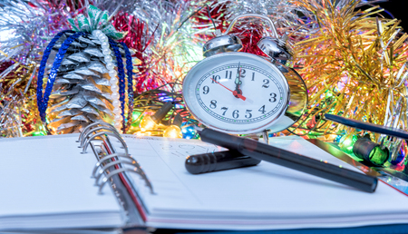 black fountain pen lying on the diary on the eve of the new yearの写真素材