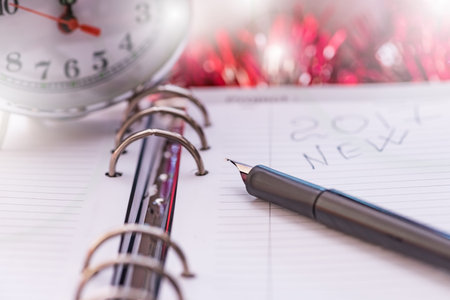 black fountain pen lying on the diary on the eve of the new year