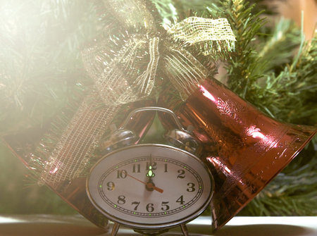 New Year Clock lie in brightly colored shiny tinsel