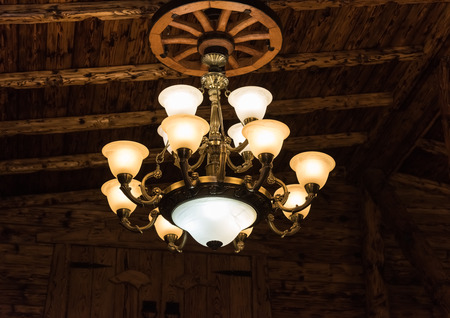 old stylish chandelier with glass ceiling wooden ceilingの写真素材