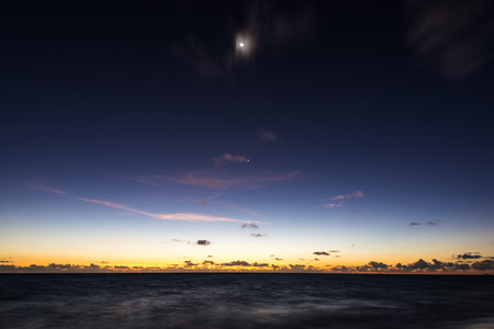 silhouette of palm beach at sunset the sunの写真素材