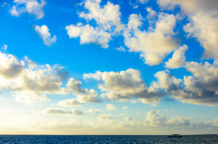 sandy beach and calm blue sea surf