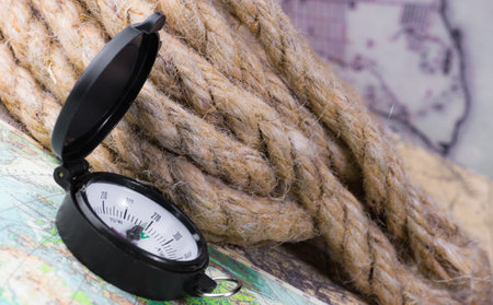 compass lies on an ancient world map