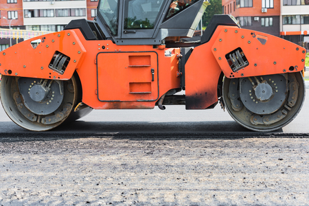 Laying a new drill bitumen asphalt in the cityの写真素材