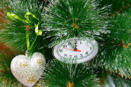 Christmas New Year clock shows the time five minutes before the holiday