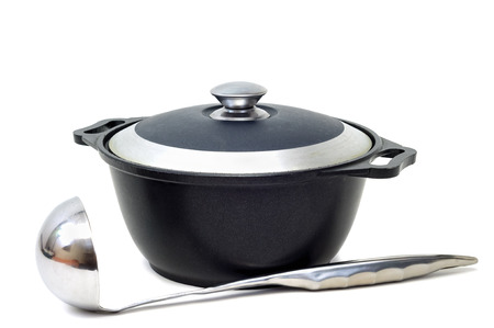iron pan with a lid and spoonの写真素材