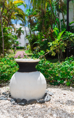 old pottery crock as decoration is on the groundの写真素材