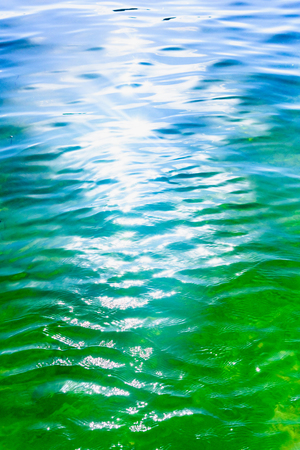 reflection of the sun on the water surfaceの写真素材