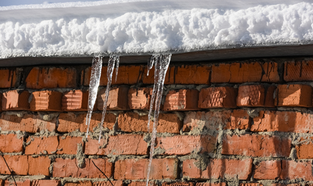 the suns beautifully hang from the roof of the house nice weatherの写真素材