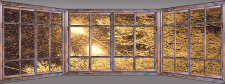 Old wooden window view of the winter landscape with a lanternの写真素材