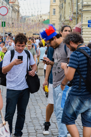 Russia, Moscow-June 2018. 2018 FIFA world Cup. On Nikolskaya street a group of football fans from different countries shouting and gesticulating is photographedのeditorial素材