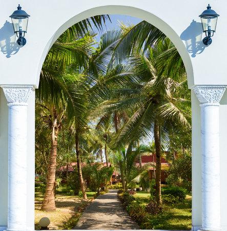 Open door arch with access to the alleyの写真素材