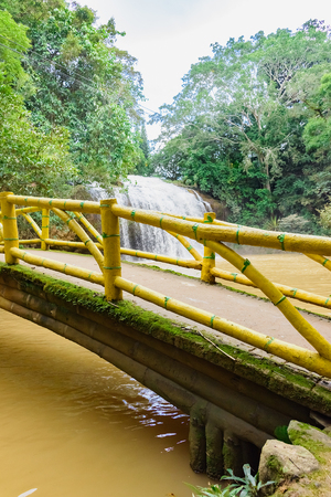 Natural beautiful mountain waterfall with lake in the jungle park, Vietnamの写真素材