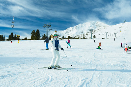 Bulgaria. Bansko. 12 February 2019. Woman on skis during winter. Girl skiing in a mountain resort on...
