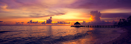 sun sea tropical sunset view of the pier of the Caribbean beach