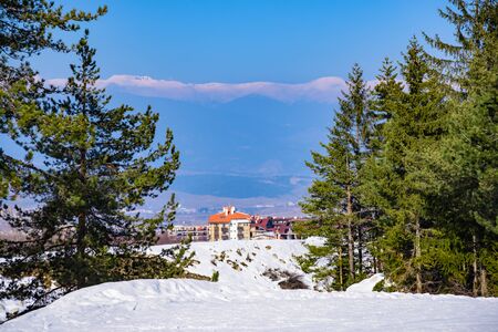 Bansko, Bulgaria - February 14, 2019: Winter ski resort Bansko, ski slope, people skiing and mountains view.のeditorial素材