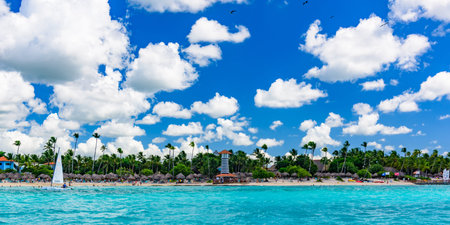La Romana, Dominican Republic. 10 October 2019. striped high lighthouse stands on the shores of the Caribbean Dominican Republic for the safety of ships. Hotel Beach Barのeditorial素材