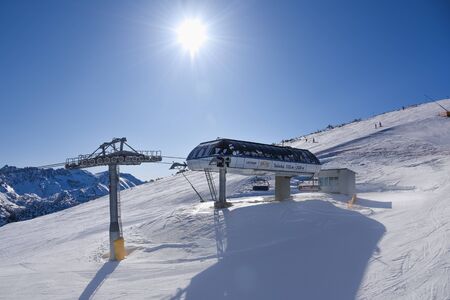 Bulgaria. Bansko. 08 February 2020.Ski resort in Bansko. Snowy ski slopes and  chair ski lifts station in  winter mountain ski resort. Under blue sky on sunny dayのeditorial素材