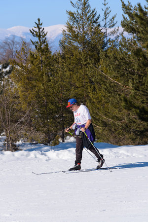 Bulgaria. Bansko. 14 February 2020.skier riding down the huge snowfield splashing powder snow.のeditorial素材