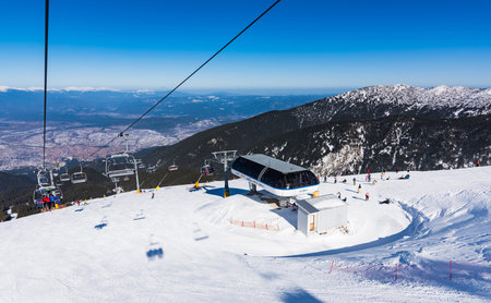 Bulgaria. Bansko. 10 February 2020.Ski resort in Bansko. Snowy ski slopes and  chair ski lifts...