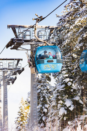 Bansko, Bulgaria - February 14, 2019: Winter ski resort Bansko, ski slope, people skiing and...