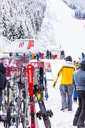 Bulgaria. Bansko. 12 February 2020.Bansko ski station, Kolarski ski lift at Banderishka polyana, skiers on ski slopes, mountain. With pine trees, people. Snowのeditorial素材